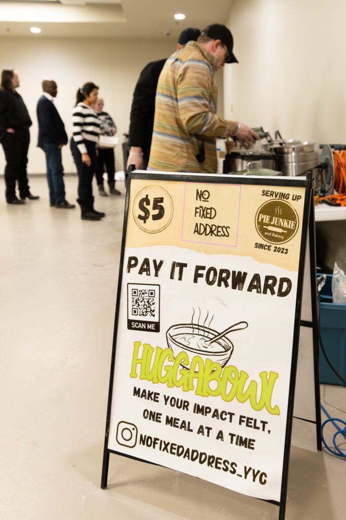 No fixed address sign board and people taking food. Shots by Britton Ledingham/iEvolve Media